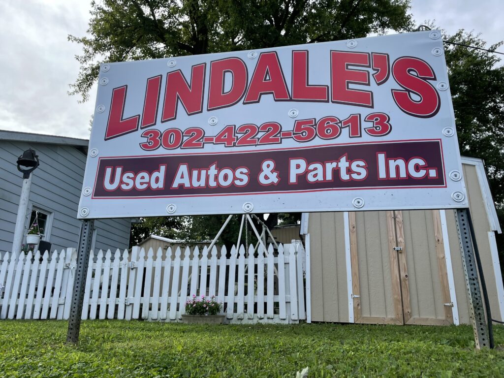 Lindale's Used Autos & Parts Inc. sign at the yard in Houston, Delaware